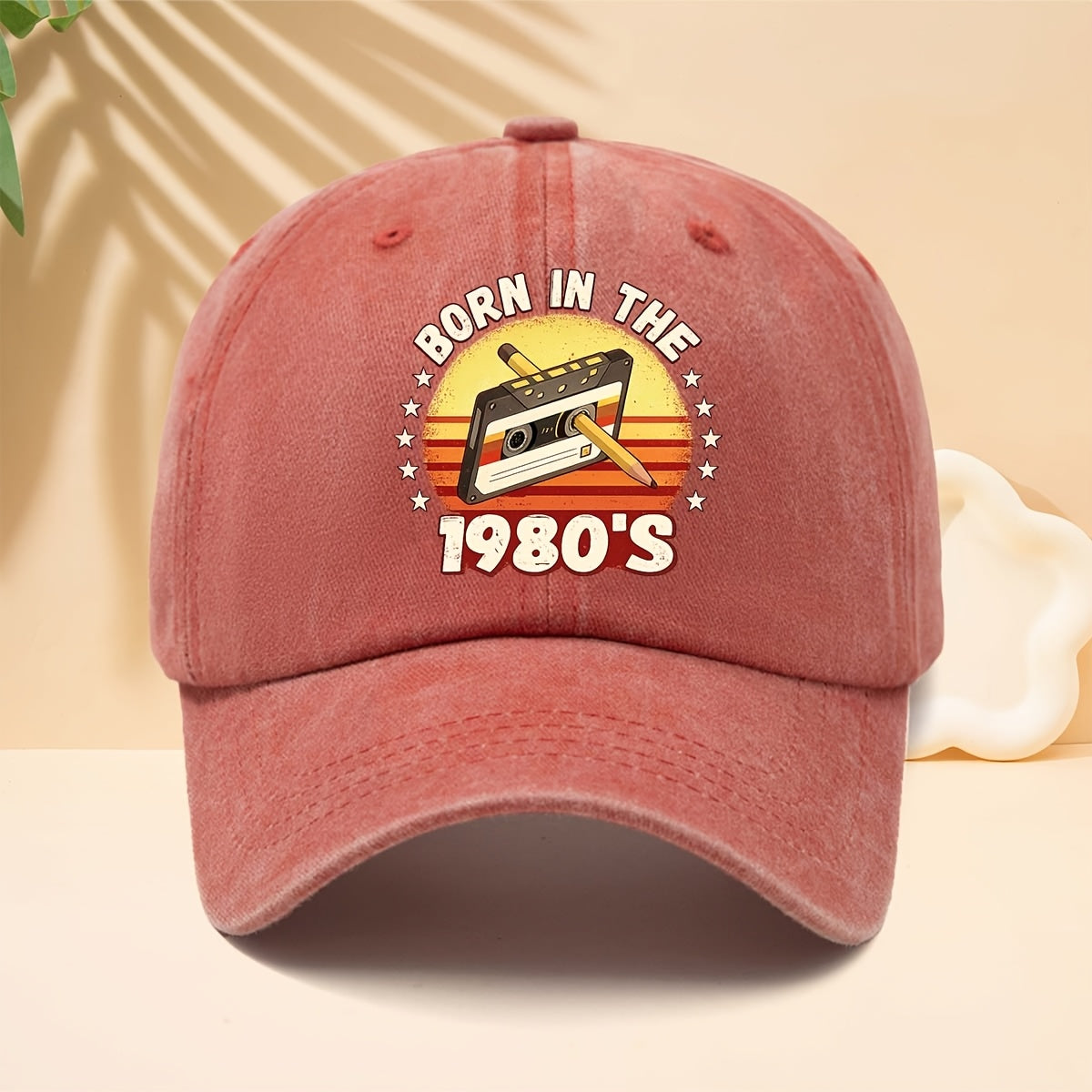 A Washed Baseball Cap with the Print "BORN IN THE 1980S". This Versatile Trucker Hat Features a Soft Crown and Curved Brim for a Comfortable Fit That Conforms to the Head. Its Relaxed, Street-style Design Is Adjustable and Suitable for Both Men
