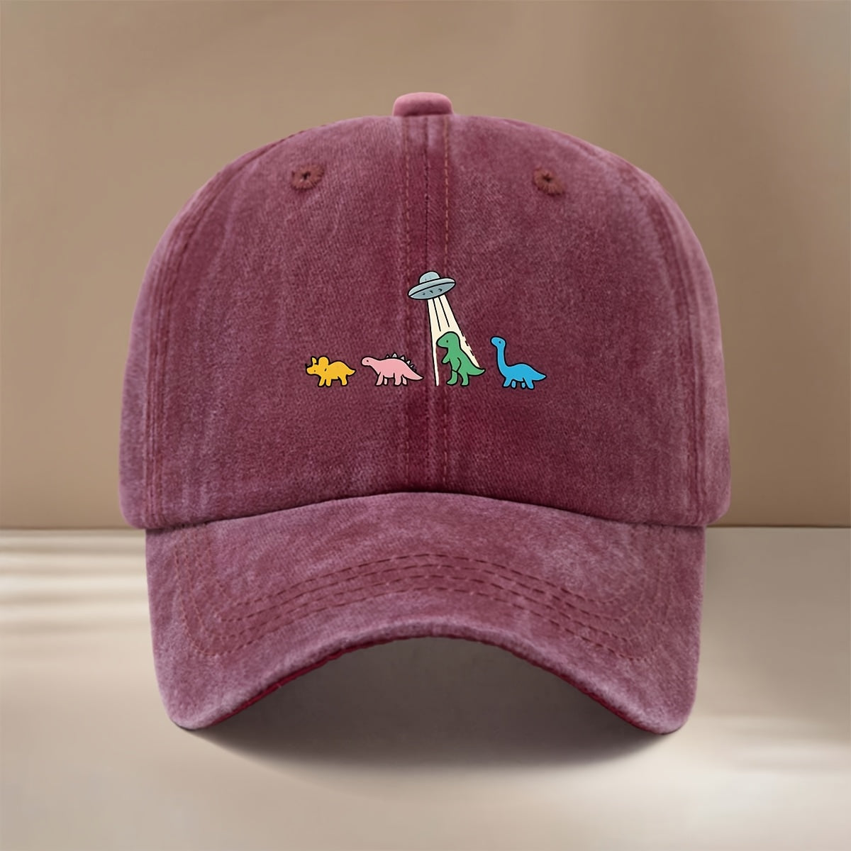 This Is a Baseball Cap with a Dinosaur and UFO Print, Suitable for All Seasons. It Features an Adjustable Size, a Curved Brim, and Is Unisex. The Hat Is Comfortable, Lightweight, and Can Be Worn for Outdoor Sports, Dinners, Camping, or as a  Fashion