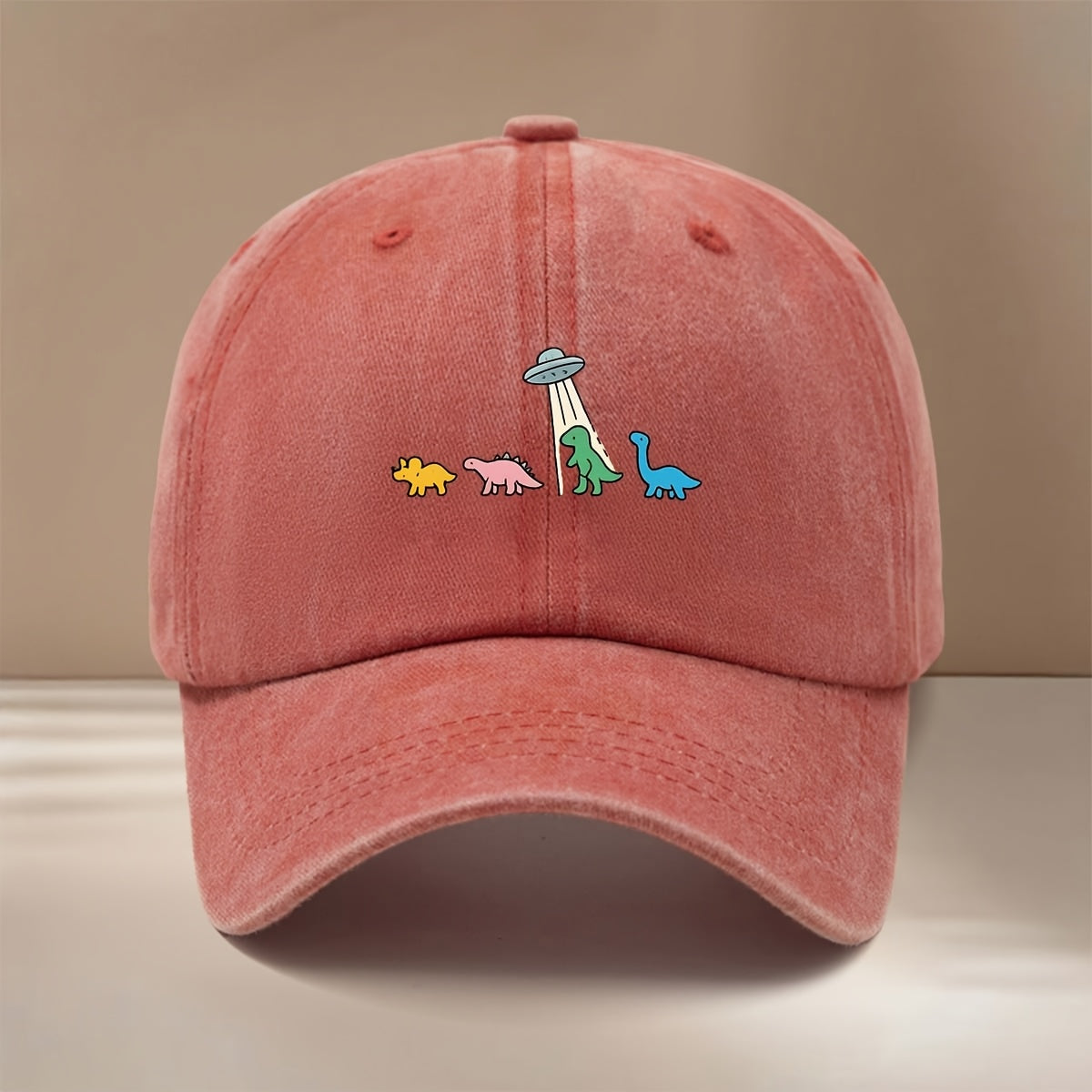 This Is a Baseball Cap with a Dinosaur and UFO Print, Suitable for All Seasons. It Features an Adjustable Size, a Curved Brim, and Is Unisex. The Hat Is Comfortable, Lightweight, and Can Be Worn for Outdoor Sports, Dinners, Camping, or as a  Fashion