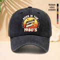 A Washed Baseball Cap with the Print "BORN IN THE 1980S". This Versatile Trucker Hat Features a Soft Crown and Curved Brim for a Comfortable Fit That Conforms to the Head. Its Relaxed, Street-style Design Is Adjustable and Suitable for Both Men
