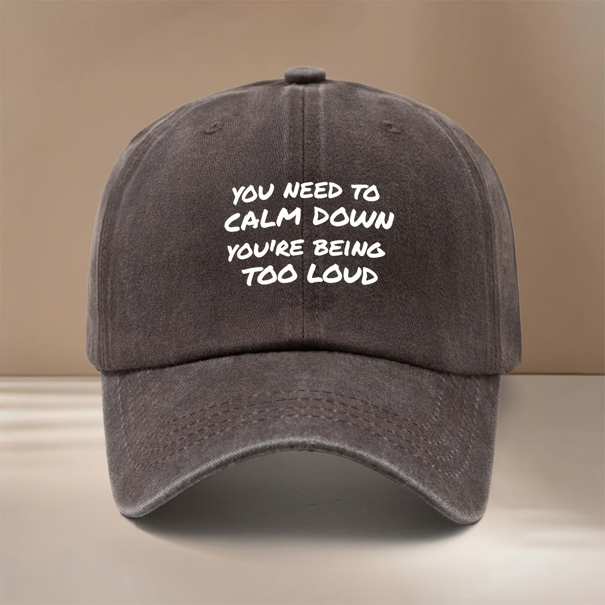 This Is a Baseball Cap Featuring the "YOU NEED to CALM DOWN YOU'RE BEING TOO LOUD" Print. It's a , Lightweight, and Adjustable-sized Casual Hat Suitable for Both Men and Women. The Simple and Stylish Duckbill Cap Is Perfect for Outdoor Sports