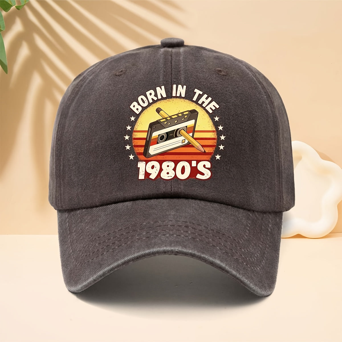 A Washed Baseball Cap with the Print "BORN IN THE 1980S". This Versatile Trucker Hat Features a Soft Crown and Curved Brim for a Comfortable Fit That Conforms to the Head. Its Relaxed, Street-style Design Is Adjustable and Suitable for Both Men