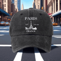 A Retro Baseball Cap Featuring a Print of The Eiffel Tower in Paris, Designed with a Relaxed Curved Brim And Soft Top, Adjustable for a Comfortable Fit, Perfect for Sports, And Stylish with a Pointed Top