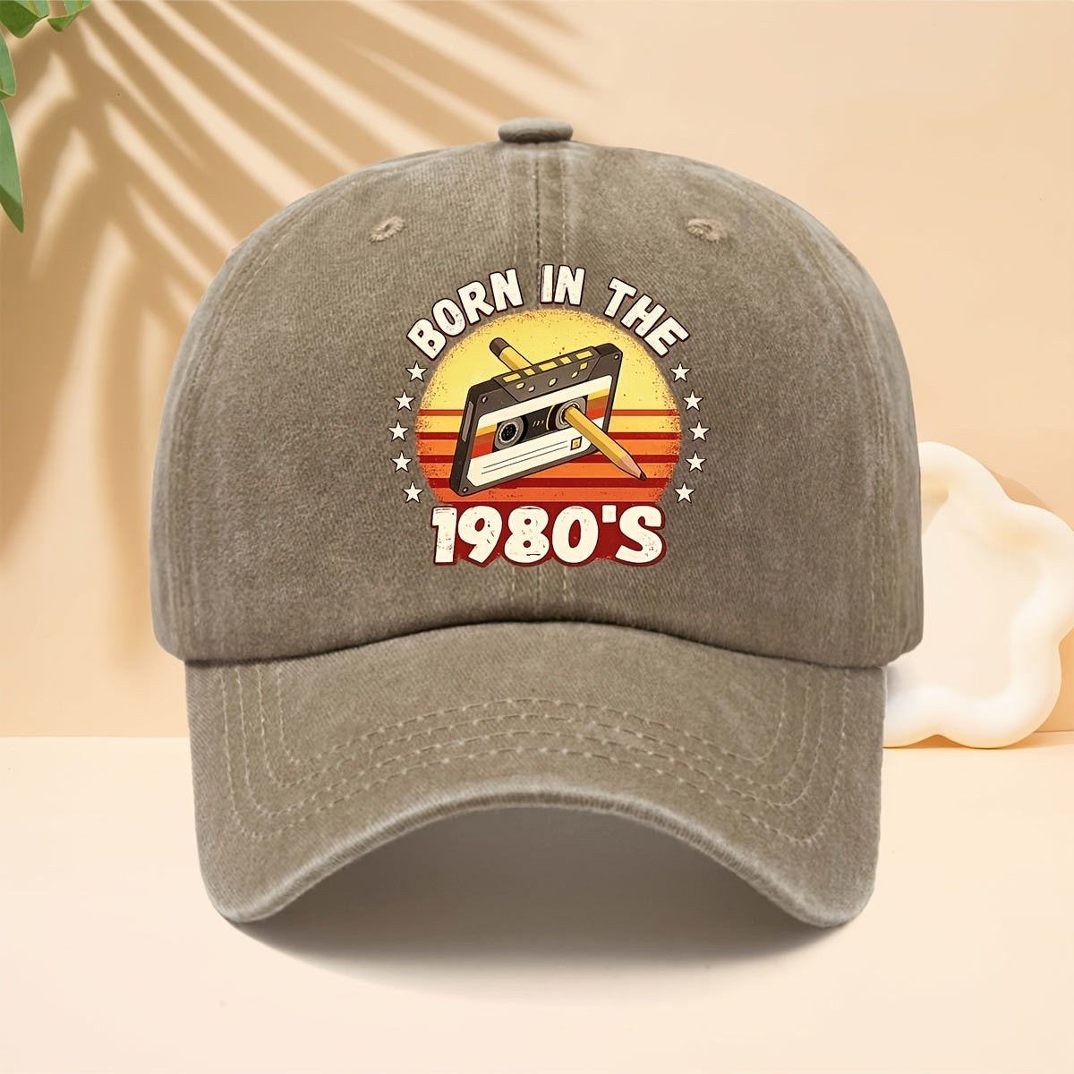 A Washed Baseball Cap with the Print "BORN IN THE 1980S". This Versatile Trucker Hat Features a Soft Crown and Curved Brim for a Comfortable Fit That Conforms to the Head. Its Relaxed, Street-style Design Is Adjustable and Suitable for Both Men