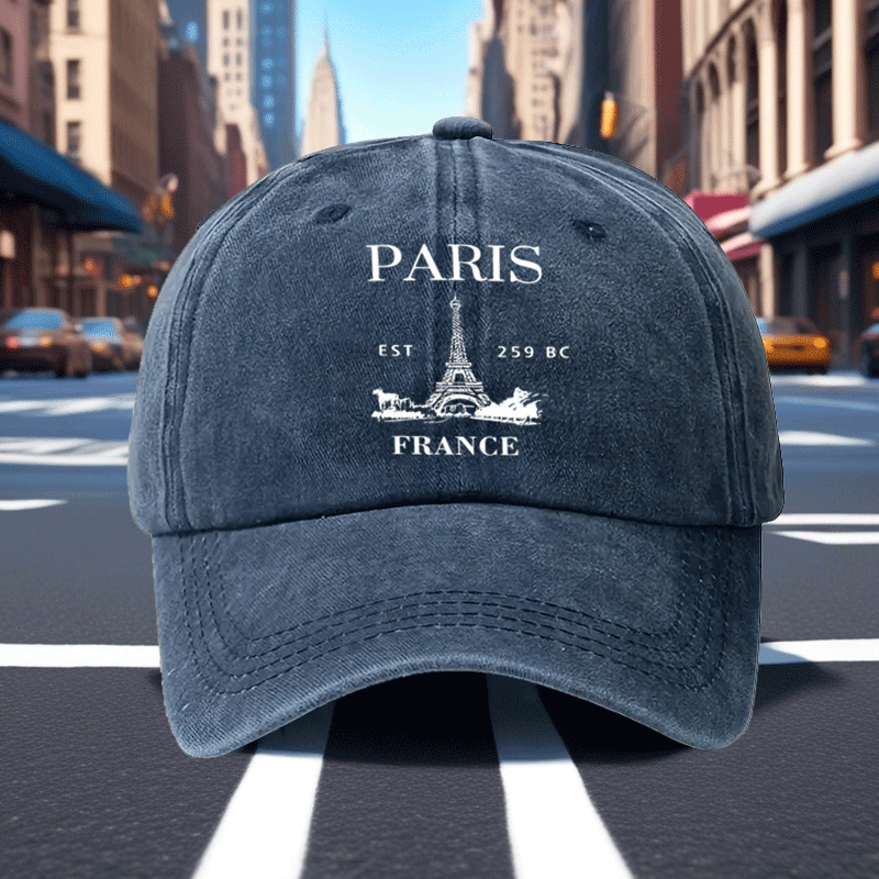 A Retro Baseball Cap Featuring a Print of The Eiffel Tower in Paris, Designed with a Relaxed Curved Brim And Soft Top, Adjustable for a Comfortable Fit, Perfect for Sports, And Stylish with a Pointed Top