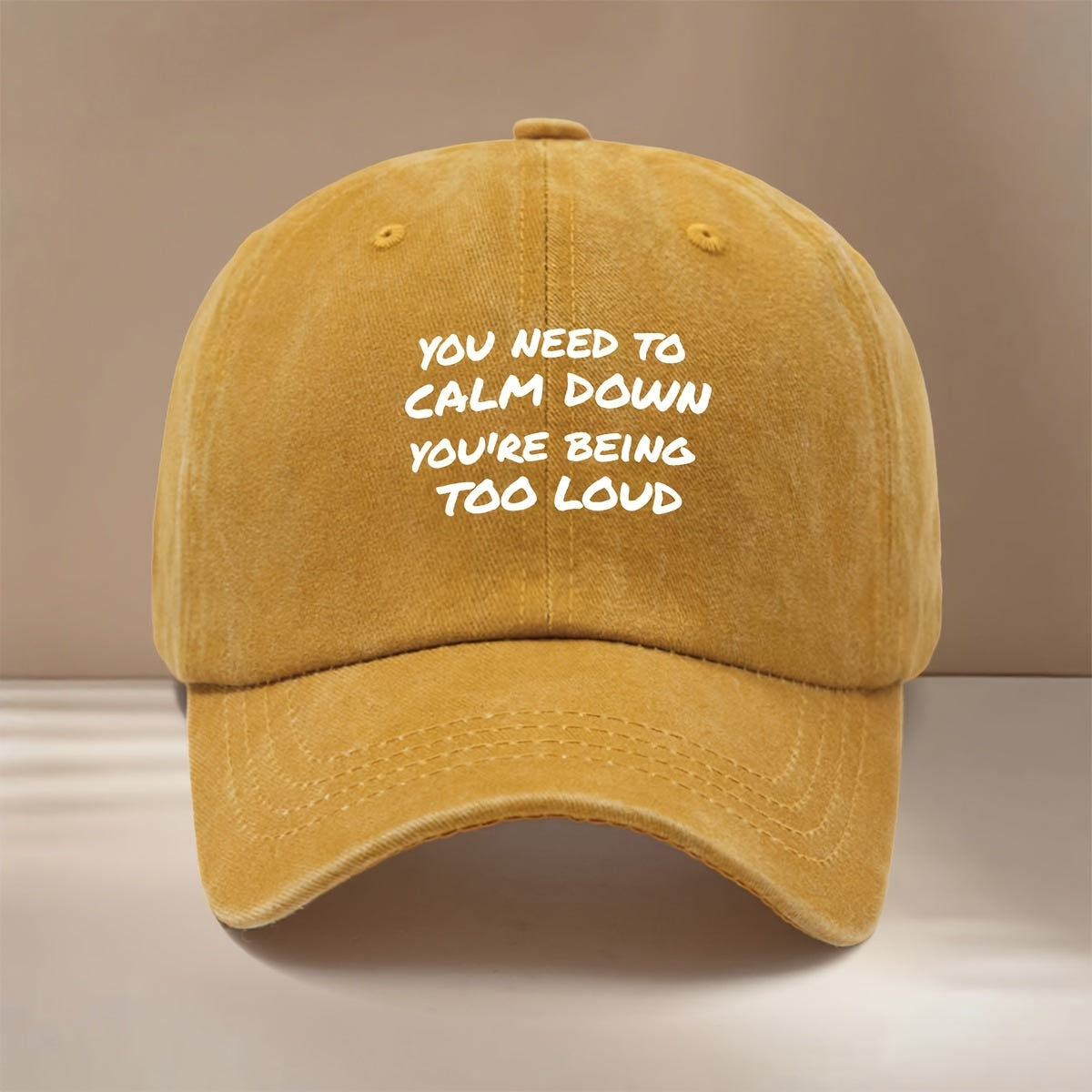 This Is a Baseball Cap Featuring the "YOU NEED to CALM DOWN YOU'RE BEING TOO LOUD" Print. It's a , Lightweight, and Adjustable-sized Casual Hat Suitable for Both Men and Women. The Simple and Stylish Duckbill Cap Is Perfect for Outdoor Sports