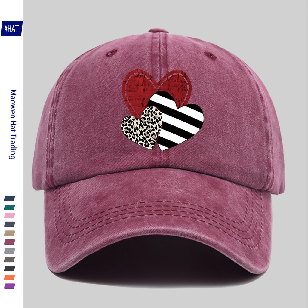 A Washed Baseball Cap with Iron-on Transfer Designs of Red Hearts, Black Striped Hearts, Leopard Print Hearts, and Crossed Hearts. It Features a New Autumn/winter Vintage Style, Is Unisex, Adjustable in Size, Lightweight, and Suitable for Outdoor Use