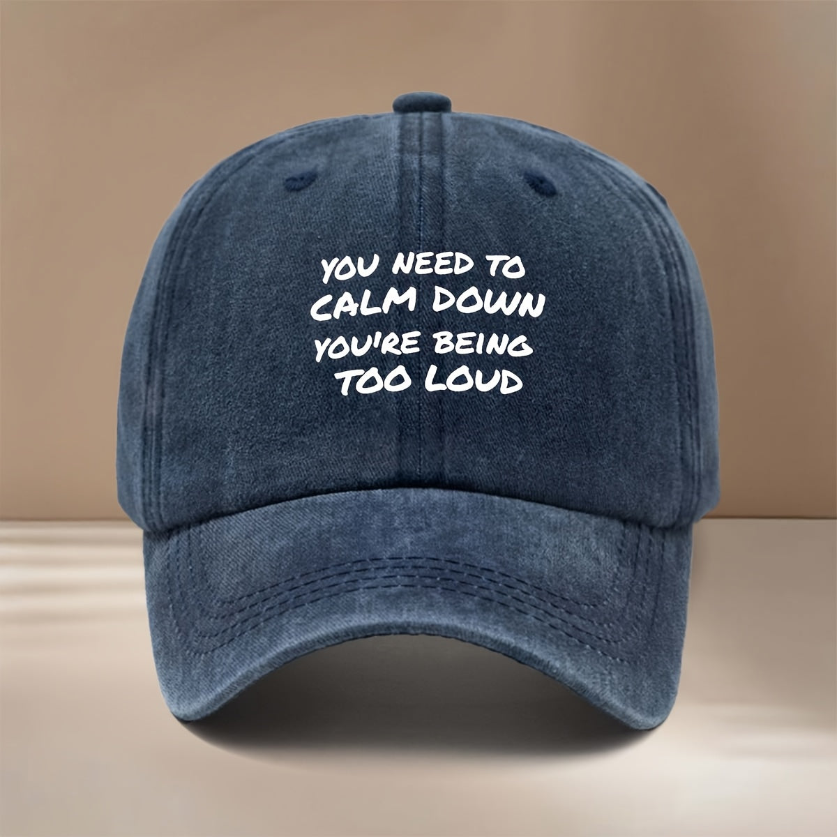 This Is a Baseball Cap Featuring the "YOU NEED to CALM DOWN YOU'RE BEING TOO LOUD" Print. It's a , Lightweight, and Adjustable-sized Casual Hat Suitable for Both Men and Women. The Simple and Stylish Duckbill Cap Is Perfect for Outdoor Sports